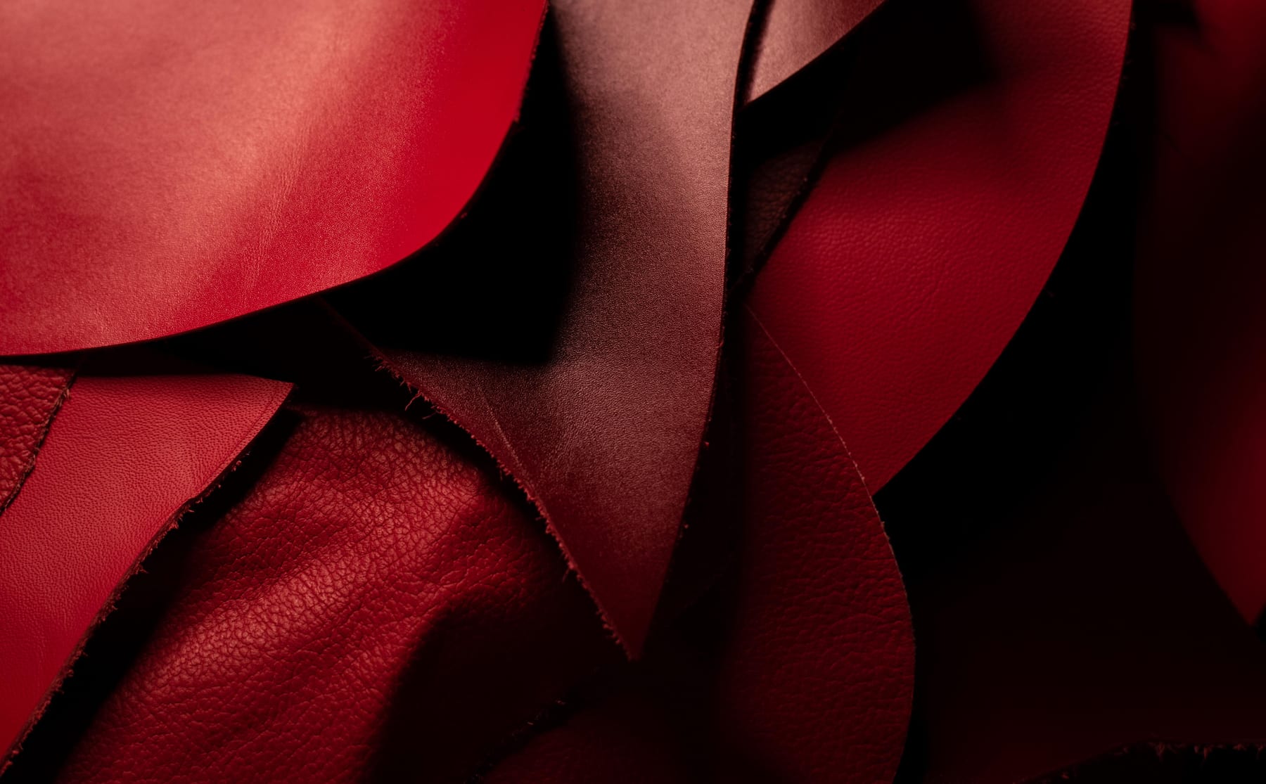 Layered red Italian leather hides