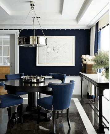 Dark blue dining chairs in a bright room