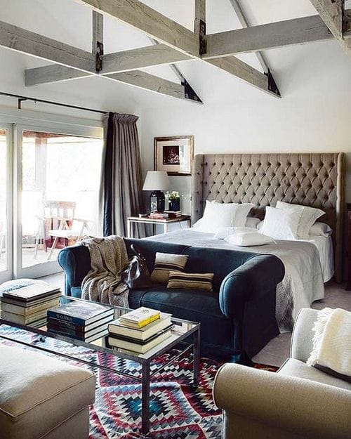 Dark blue leather seating in a bright bedroom