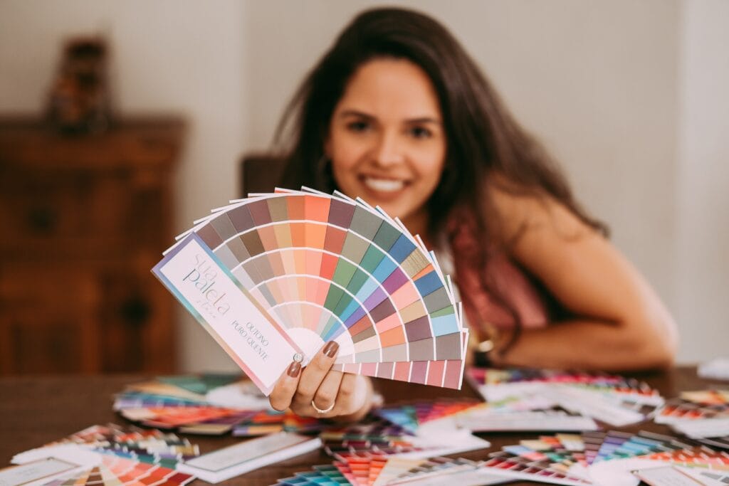Designer presenting a fan of colour samples