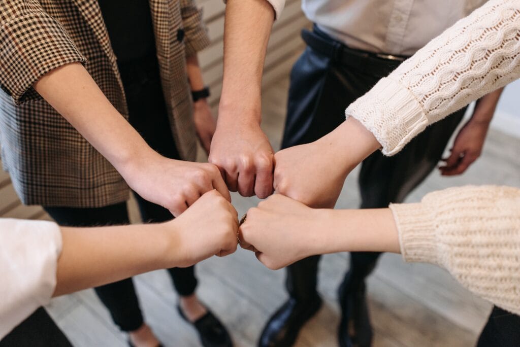 A group joining hands