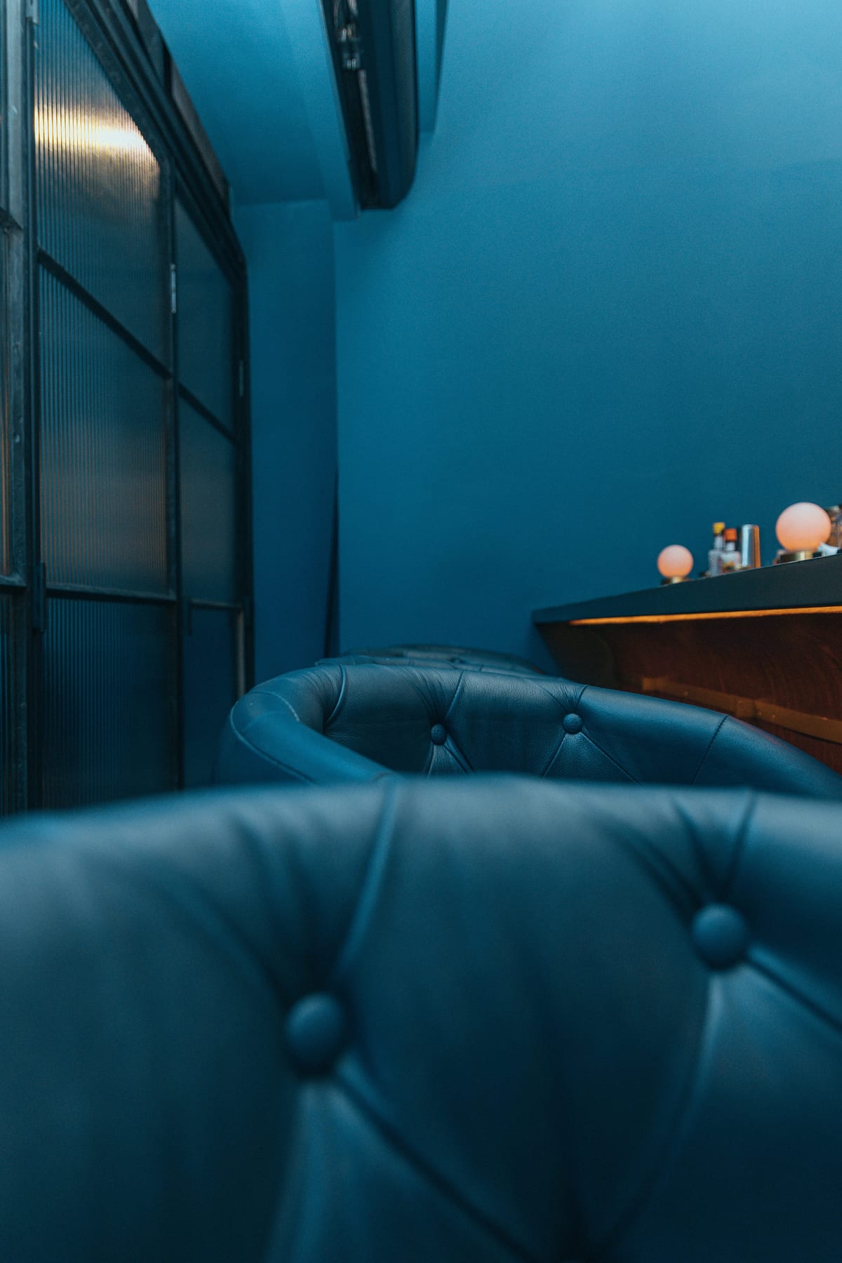 Deep blue leather chairs in an elegant interior