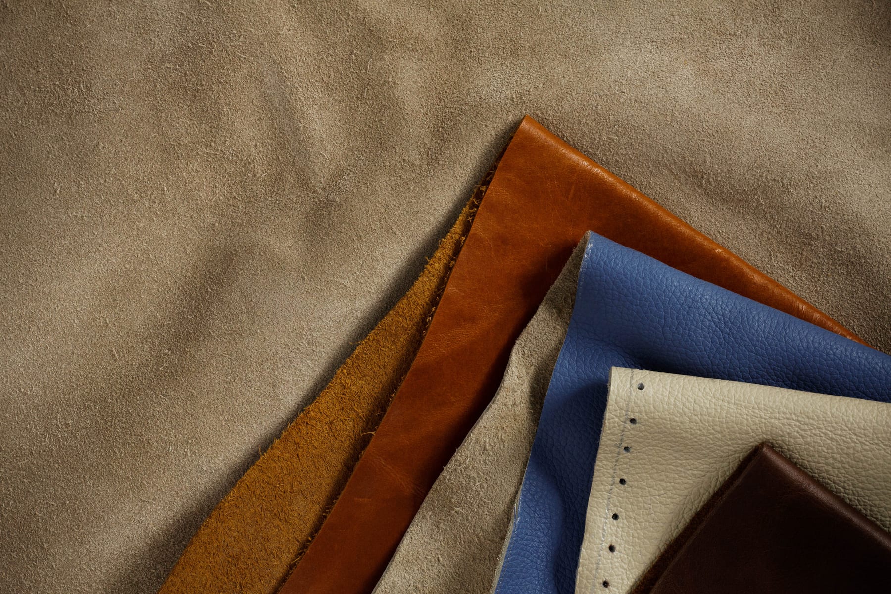 Layered genuine leather hides in earthy tones