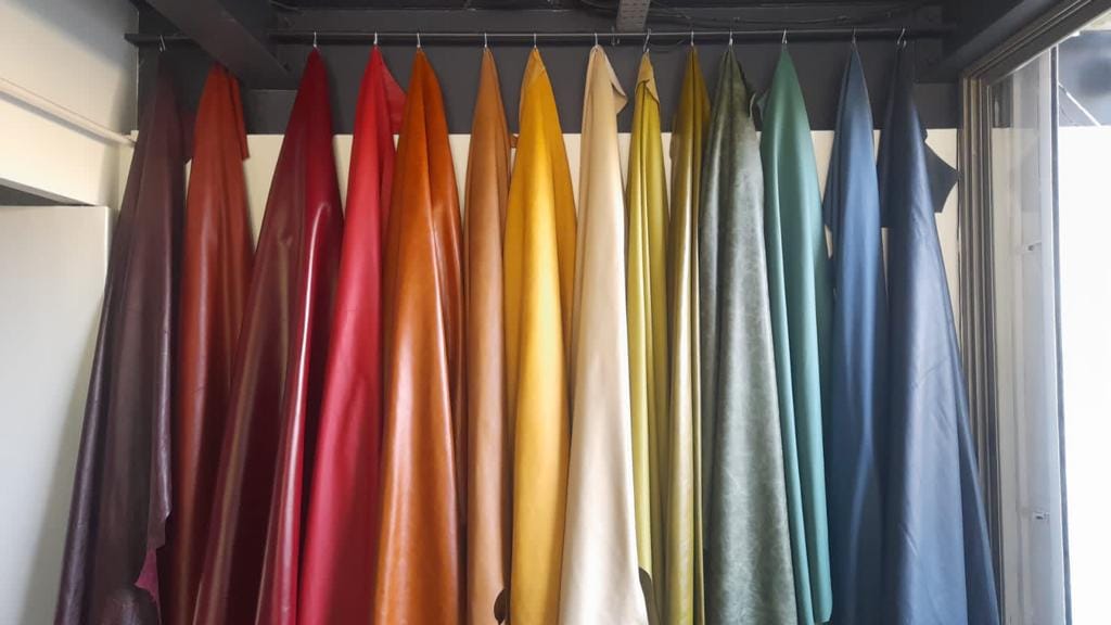 Colourful leather hides displayed in a showroom